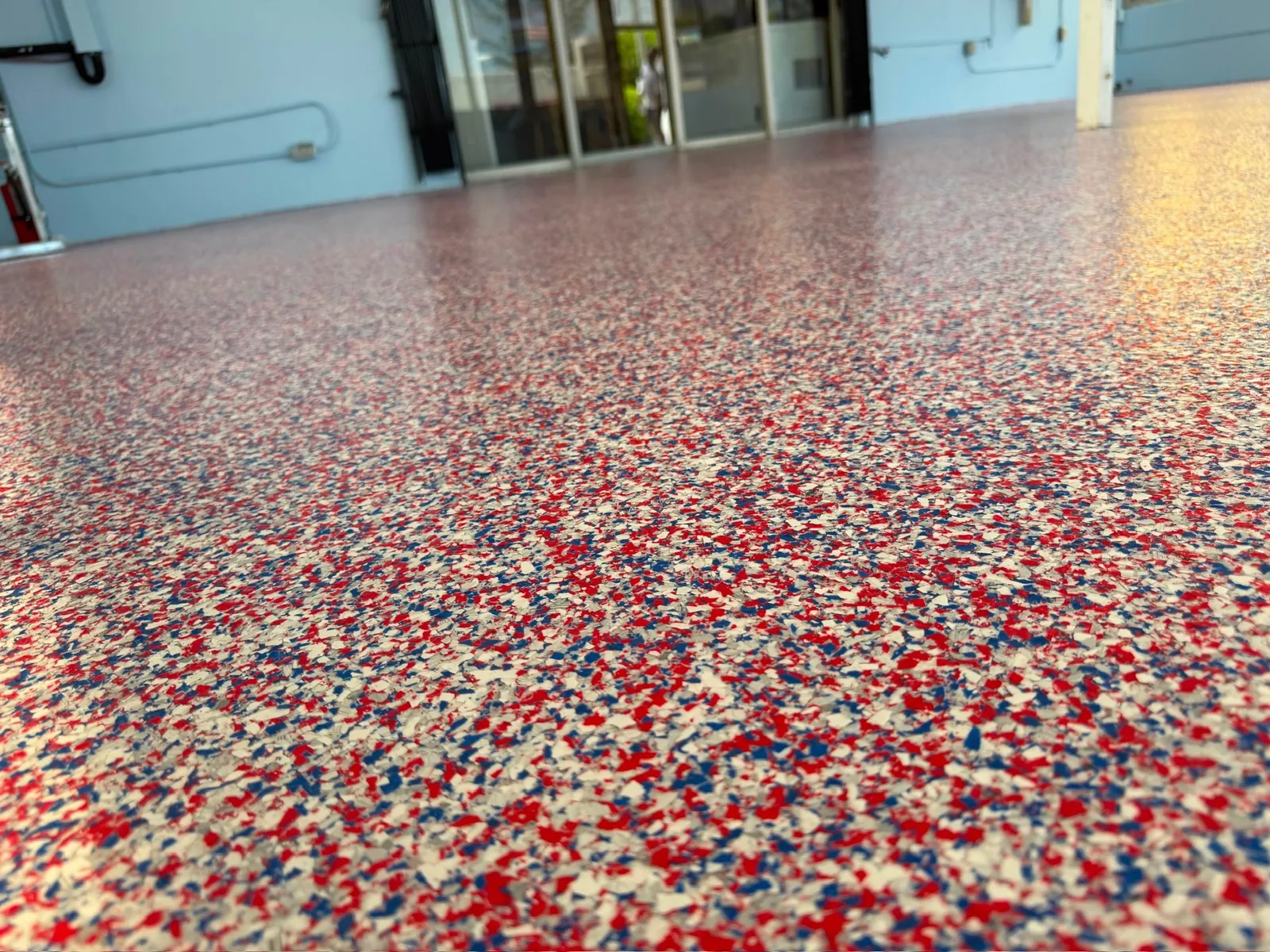 Red white and blue flake floor in a restaurant bar