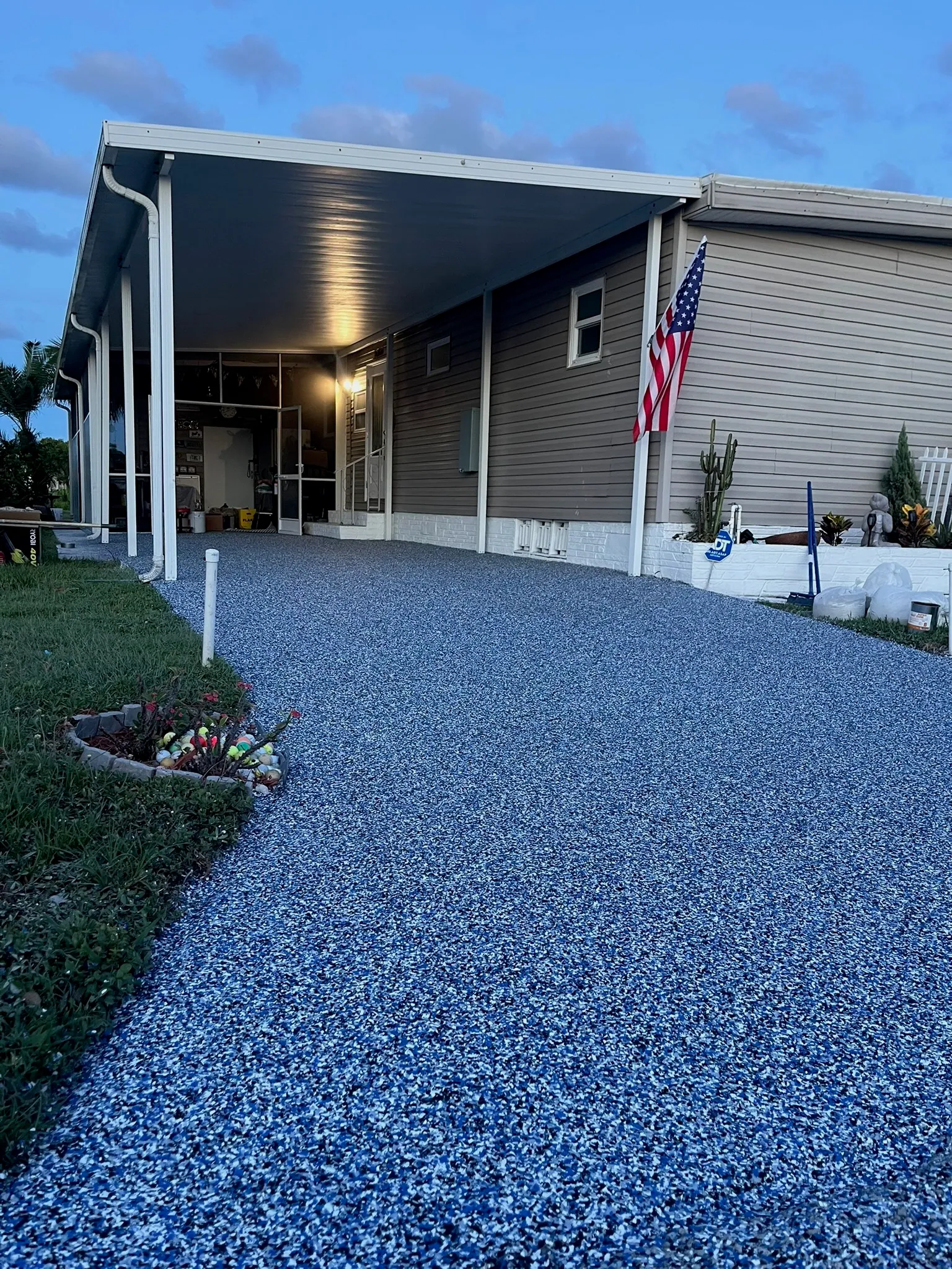 Driveway finished in a deep blue flake blend at dusk
